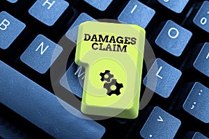 Text caption presenting Damages Claim. Conceptual photo Demand Compensation Litigate Insurance File Suit Typing Online