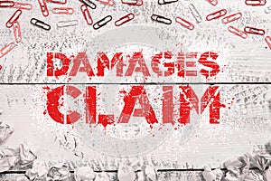 Text caption presenting Damages Claim. Word Written on Demand Compensation Litigate Insurance File Suit