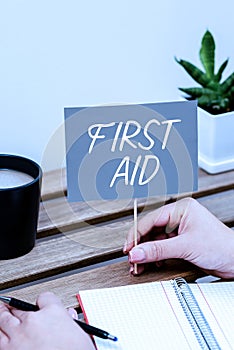 Text caption presenting First Aid. Word for Practise of healing small cuts that no need for medical training