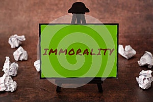 Text caption presenting Immorality. Business idea the state or quality of being immoral, wickedness