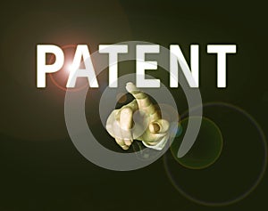 Sign displaying Patent. Concept meaning intellectualproperty that gives owner legal right has the sole right photo