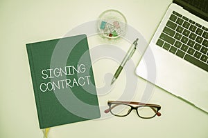 Text caption presenting Signing Contract. Business idea the parties signing the document agree to the terms Office