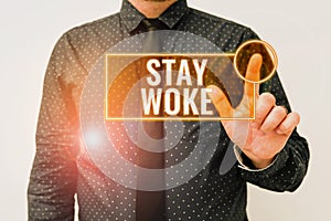 Text caption presenting Stay Woke. Internet Concept being aware of your surroundings and things going on Keep informed