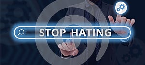 Text caption presenting Stop Hating. Concept meaning cease hostility and aversion deriving from fear, anger, or sense of