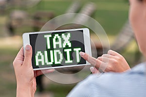 Text caption presenting Tax Audit. Business approach examination or verification of a business or individual tax return