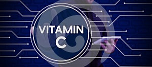 Text caption presenting Vitamin C. Business overview it promotes healing and helps the body absorb iron Ascorbic acid