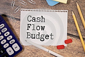 Text CASH FLOW CONTROL on sticky notes with copy space and paper clip isolated on red background