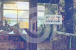 Text Closed door sign and hanging up on glass door