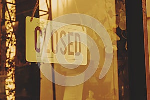 Text Closed door sign and hanging up on glass door