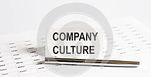 Text Company Culture, on stickers,pen on the background of documents. Financial bookkeeping, Accounting Concept. Top view