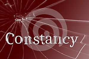 The text Constancy on the broken glass