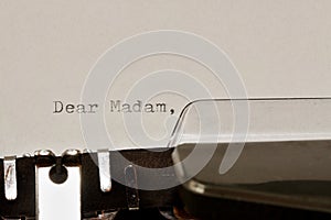 Text Dear madam typed on old typewriter