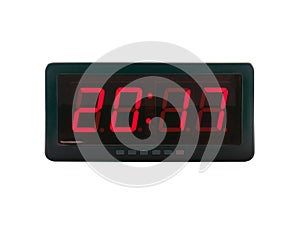 close up red led light illumination numbers 2017 on black digital electric alarm clock face isolated on white background