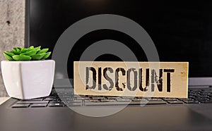 text discount on a wooden background