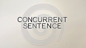 Text displaying the phrase concurrent sentence on a neutral background in a modern style photo