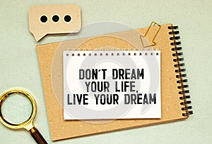 text Dont dream your life, live your dream on white paper