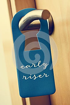 Text early riser in a door hanger photo