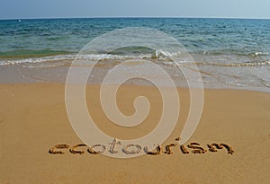 Text ecotourism in the sand photo
