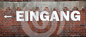 text EINGANG on the wall which means EXIT in german