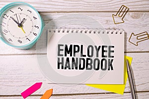 Text Employee handbook on white paper business concept