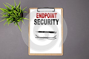 Text ENDPOINT SECURITY on brown clipboard on the grey background. Business concept