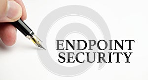 Text ENDPOINT SECURITY on white background with man& x27;s hand and pen