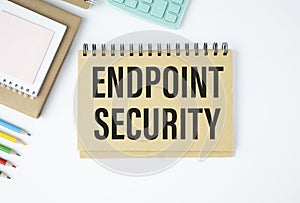 text Endpoint Security on yellow paper next to financial reports, calculator