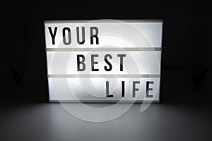 Text in english spelling Your Best Life on a lightbox