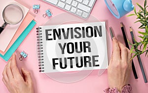 Text Envision Your Future on notepad as business concept image. photo