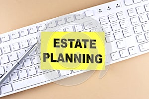 Text ESTATEE PLANNING ext on a sticky on keyboard, business concept