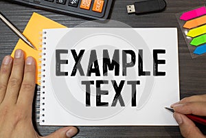 text EXAMPLE text on the short note texture background with pen