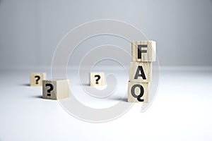text of FAQS on wooden cubes, faq concept
