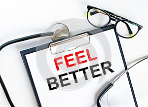 Text Feel Better in the folder with the stethoscope and glasses