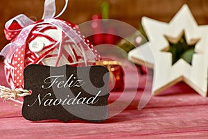 Text feliz navidad, merry christmas in spanish