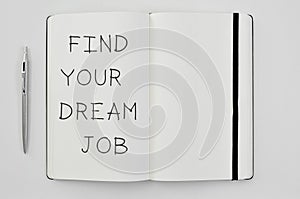 Text find your dream job in a notepad