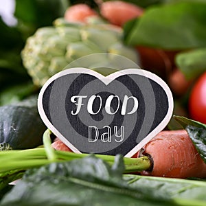 Text food day and raw vegetables