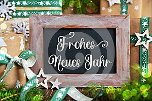 Text Frohes Neues Jahr, Means Happy New Year, With Sustainable Christmas Decoration photo