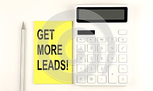 Text GET MORE LEADS on the yellow sticker, next to pen and calculator