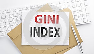 Text GINI INDEX on the envelope on the keyboard