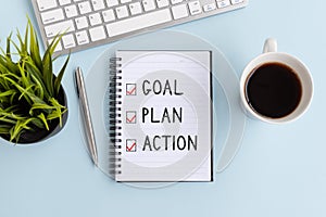 Text Goal, Plan and Action on notepad photo