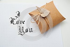 Text god bless you on paper texture and gift box with heart