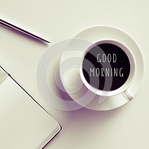 Text good morning on a cup of coffee or tea