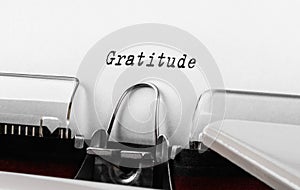 Text Gratitude typed on retro typewriter. Business concept