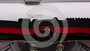 text HAPPY BIRTHDAY written with a vintage typewriter with black ink