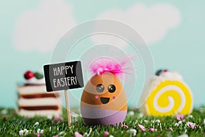 Text happy easter and handmade easter egg