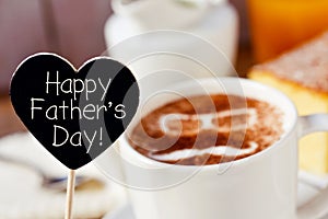 Text happy fathers day and a cup of cappuccino