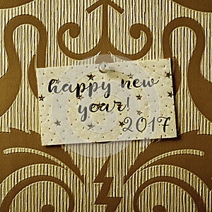 Text happy new year 2017 in a note