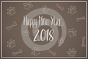 The text of the happy new year 2018 on the background of the dog tracks and bone. Vector