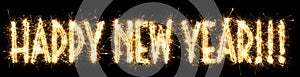 Text Happy New Year written sparkling sparklers . Hand lettering isolated on black background. Beautiful glowing overlay template