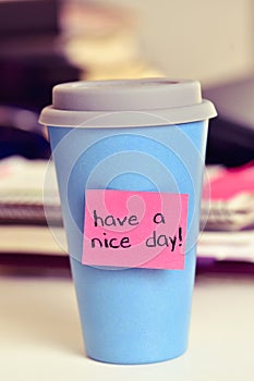 Text have a nice day in a cup of coffee or tea